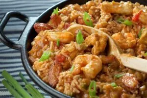 Rice dish with shrimp, sausage and chicken in a red sauce