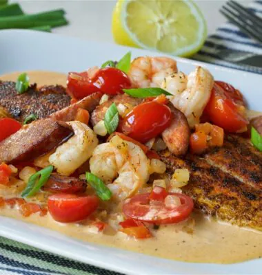Blackened Redfish in a New Orleans style cream sauce with tender Shrimp, smoked Sausage, fresh tomatoes, onion and red peppers. Served over steamed rice.